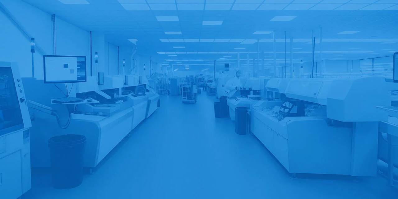 Electronics production floor with assembly lines in NOTE blue - industrial electronics manufacturing UK