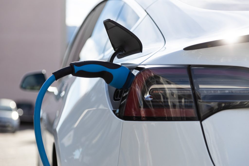 Electric vehicle plugged into a charging cable